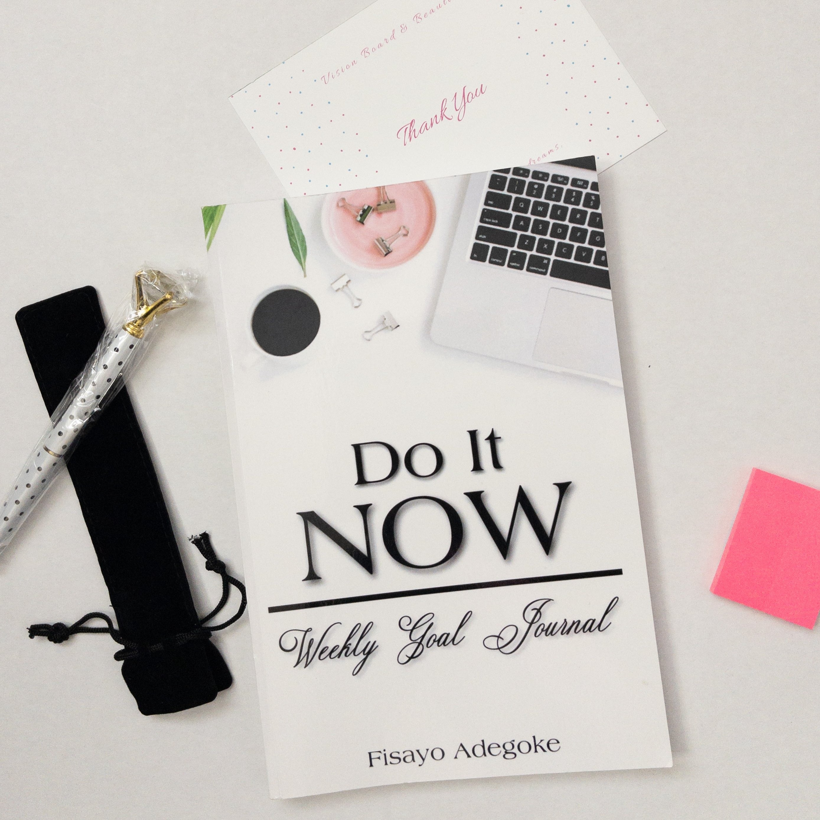 Inside the do it now bundle: the do it now journal, a crown pen, and a magnetic bookmark