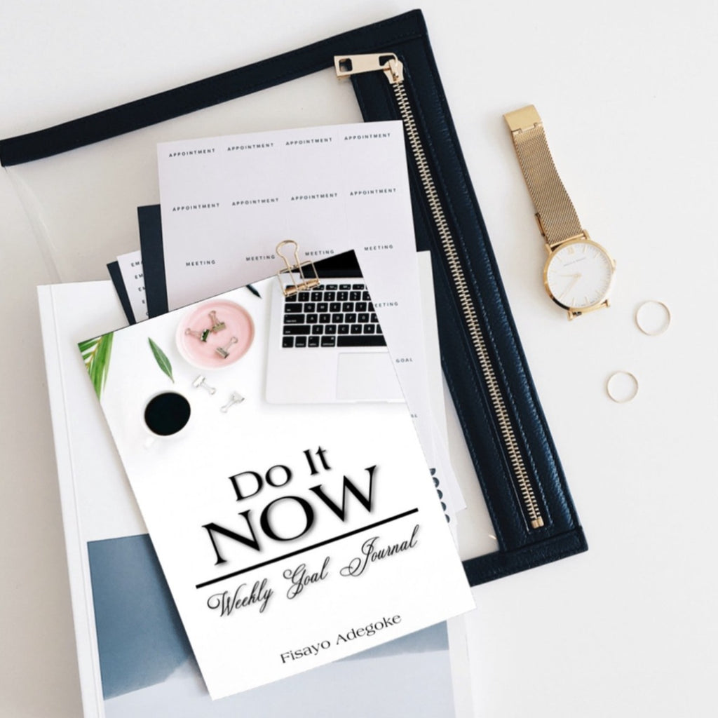 the do it now weekly goal journal in a flatlay format